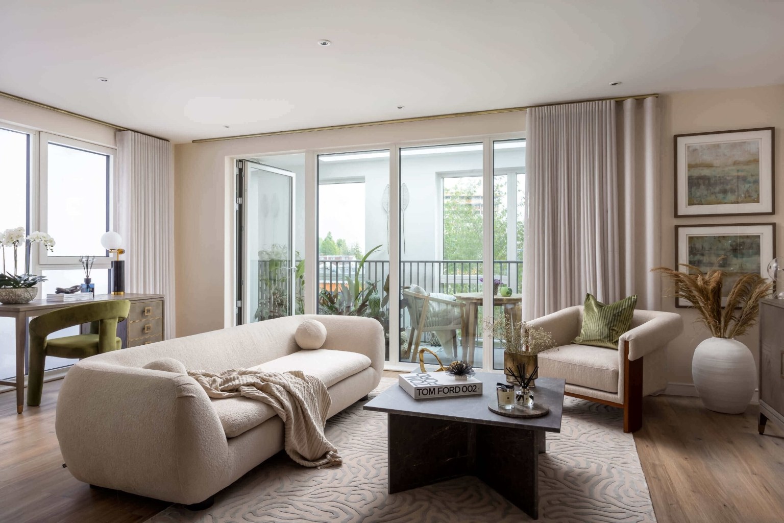 Open plan living room and kitchen inside an apartment at The Green Quarter