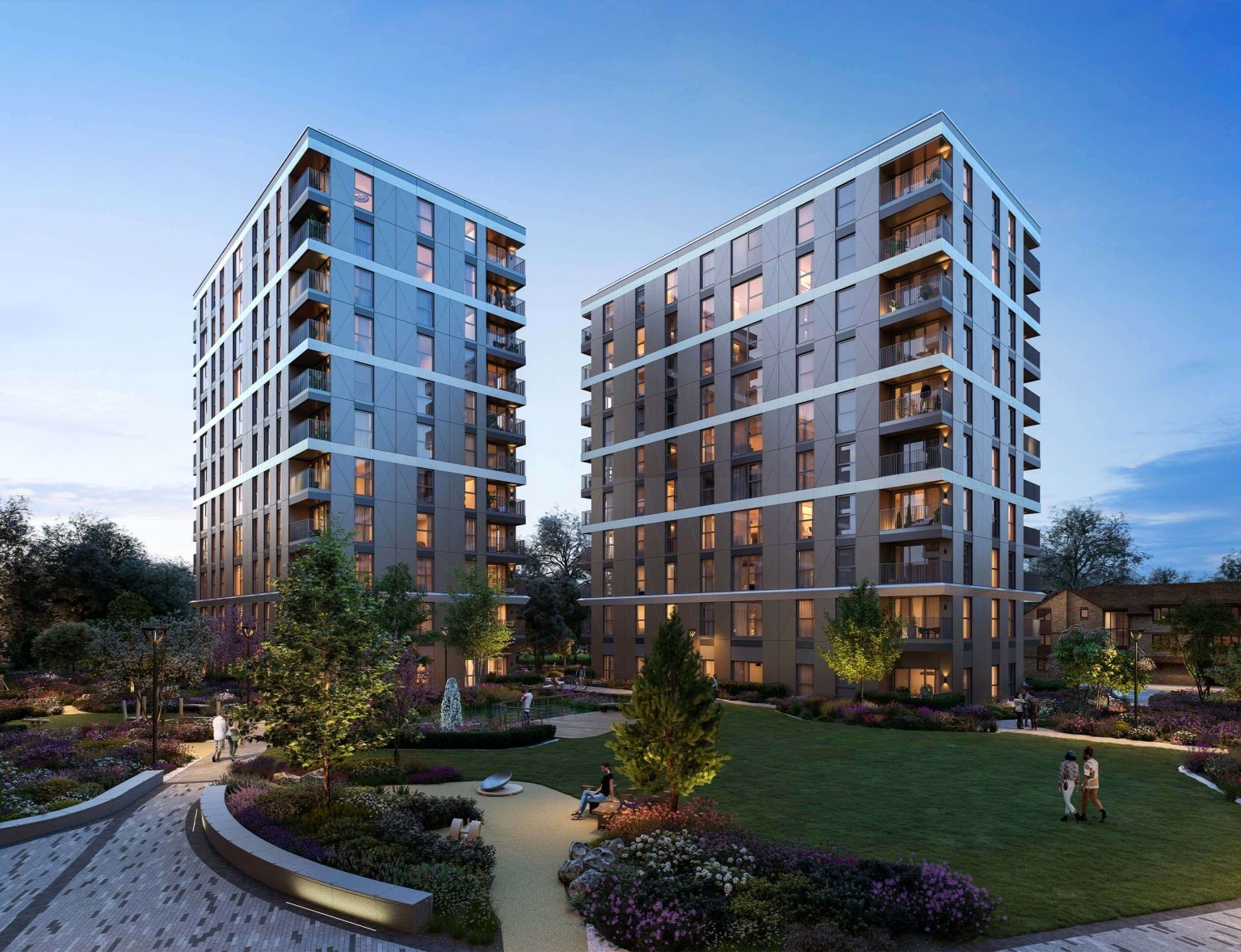 Two blocks overlooking a landscaped garden at Eden Grove, Staines, in the evening