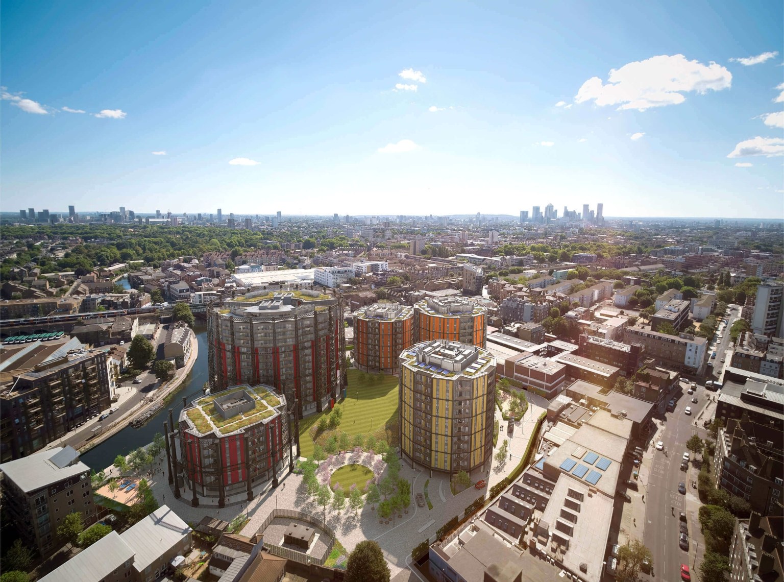 Aerial view of Regent's View: cylindrical blocks on Regent's Canal and the Canary Wharf skyline