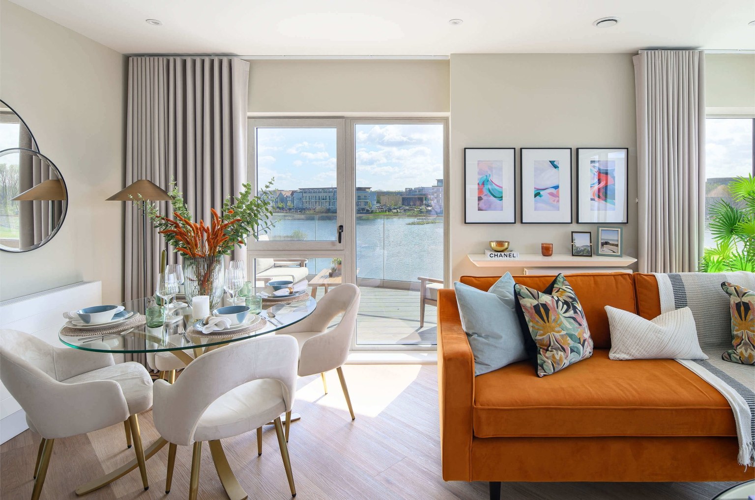 A living and dining area with lake views at Bankside Gardens, Reading