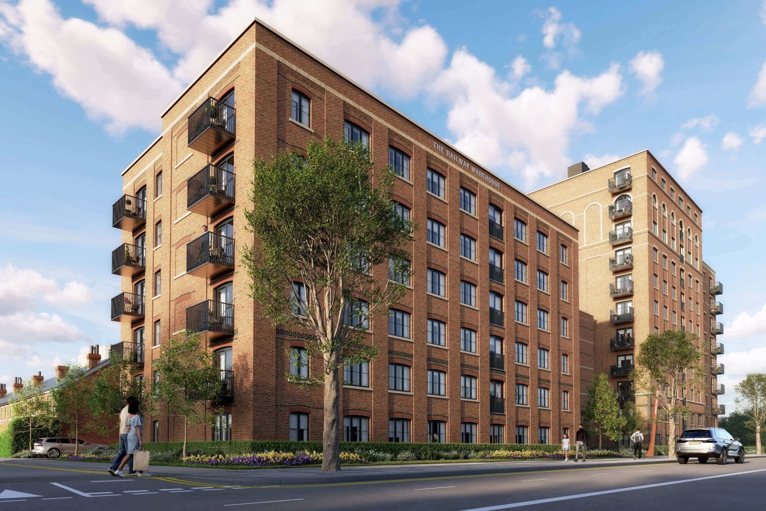 A brick building converted from warehouse architecture, with balconies, at Reading Riverworks