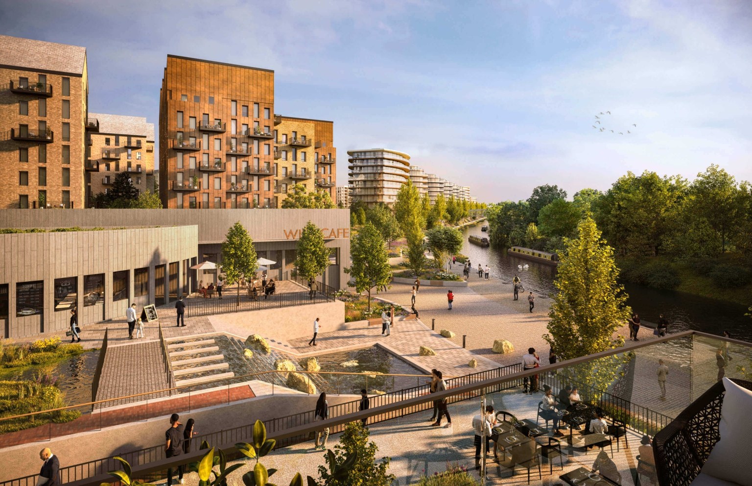 The canalside café terrace and walkway at The Green Quarter, Southall