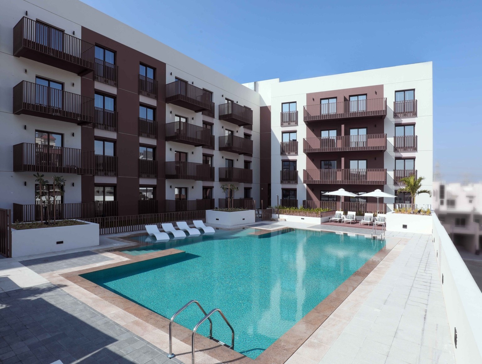 The pool terrace and landscaped communal areas at Eaton Place