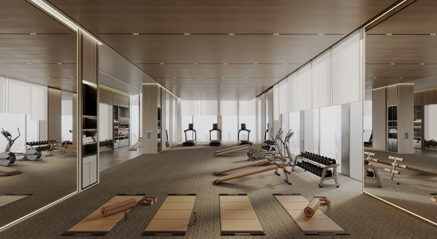 TITANIA by Binghatti Majan projesinde koşu bantları ve yoga matlarının bulunduğu spor salonu