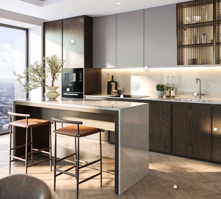 An island kitchen with dark wood units and London views at 100 Kensington