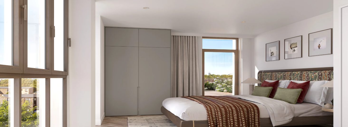 A bedroom with fitted wardrobes opening onto the balcony at Wimbledon Place