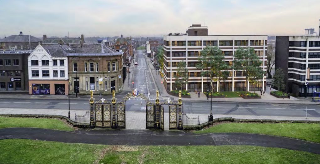 The historic iron gates and the new building opposite at Park View, Manchester