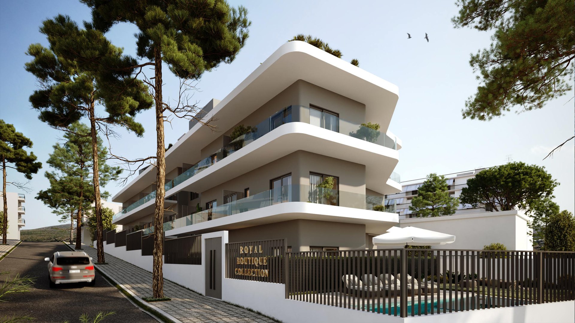 Royal Boutique Collection binasının ağaçlar arasındaki sokak cephesi